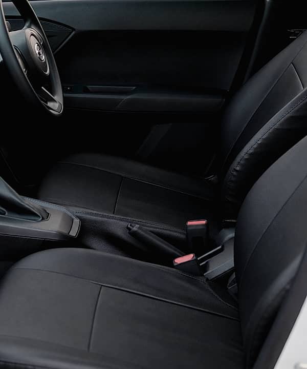 Close-up of the dashboard, gear shift, and passenger seat.